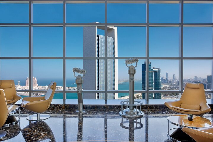 Experience breathtaking views from the Etihad Tower Observation Deck overlooking the stunning skyline of Abu Dhabi while enjoying exquisite high tea in a luxurious setting.